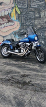 Load image into Gallery viewer, 2006–2017 Harley Dyna motorcycle with Stealth Pipes exhaust system installed – stainless muffler upgrade