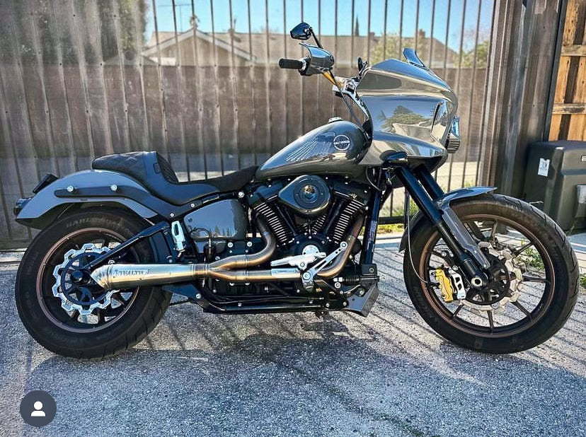 Stealth Pipes exhaust system installed on Harley M8 Softail – rear-side view of muffler and headers (2017–2025)