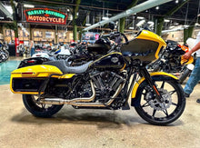 Load image into Gallery viewer, Harley M8 Bagger with Stealth Pipes exhaust system – polished stainless muffler, rider lifestyle photo