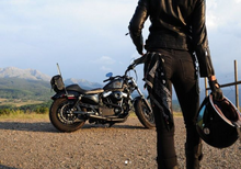 Load image into Gallery viewer, Harley Sportster motorcycle with Stealth Pipes exhaust – rider-side lifestyle photo