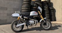 Load image into Gallery viewer, Honda Monkey with Stealth x Kruesi Originals exhaust system – rear angle showing stainless muffler